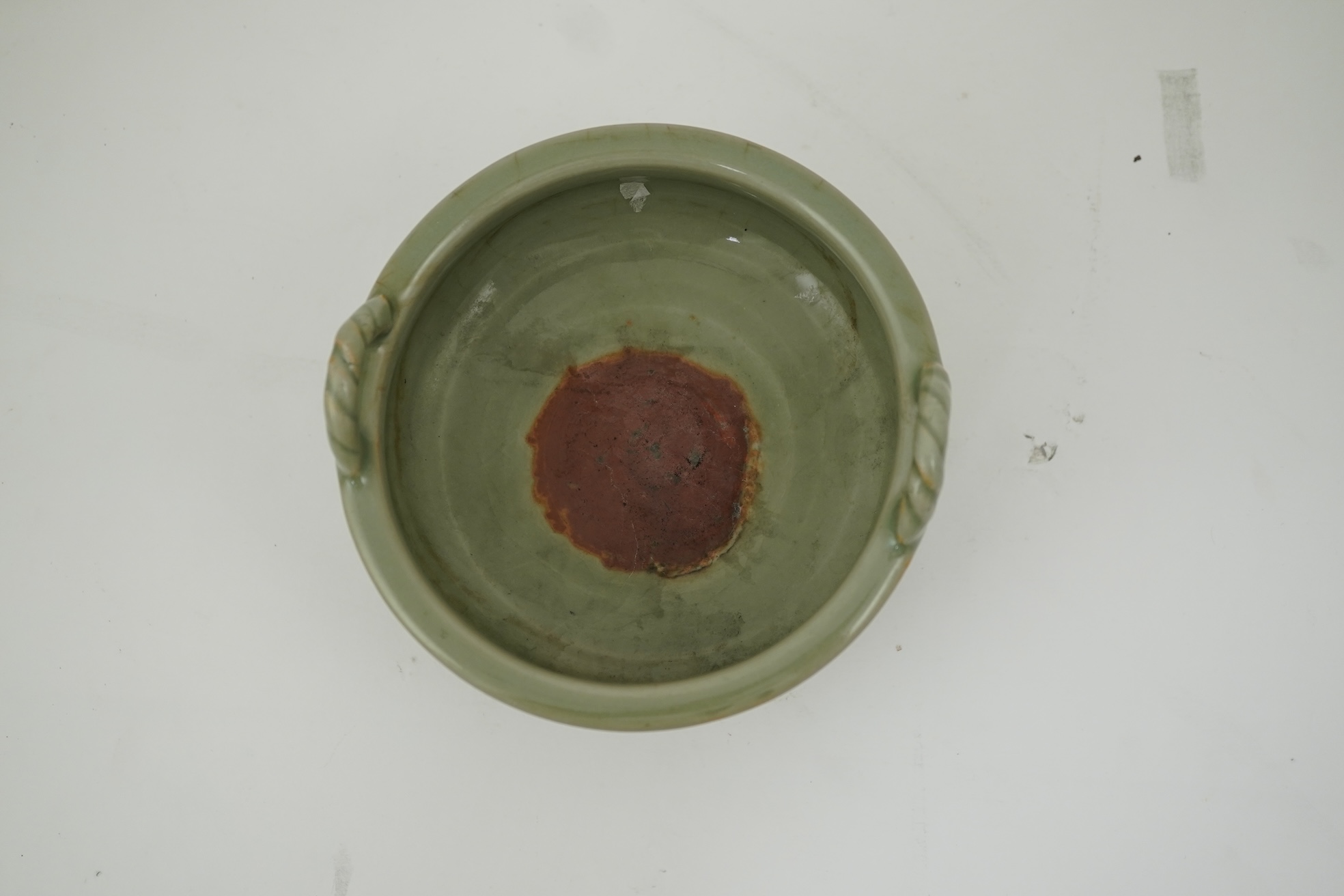A Chinese Longquan celadon crackle glazed tripod censer, Ming dynasty or later